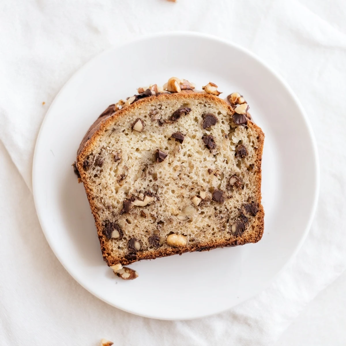 Freshly baked super moist banana bread cooling on wire rack, ready for breakfast or snacking