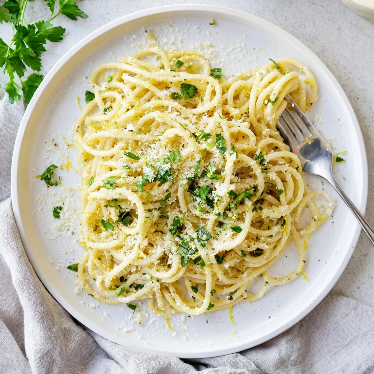 Golden one pot garlic butter pasta coated in creamy Parmesan sauce with fresh parsley