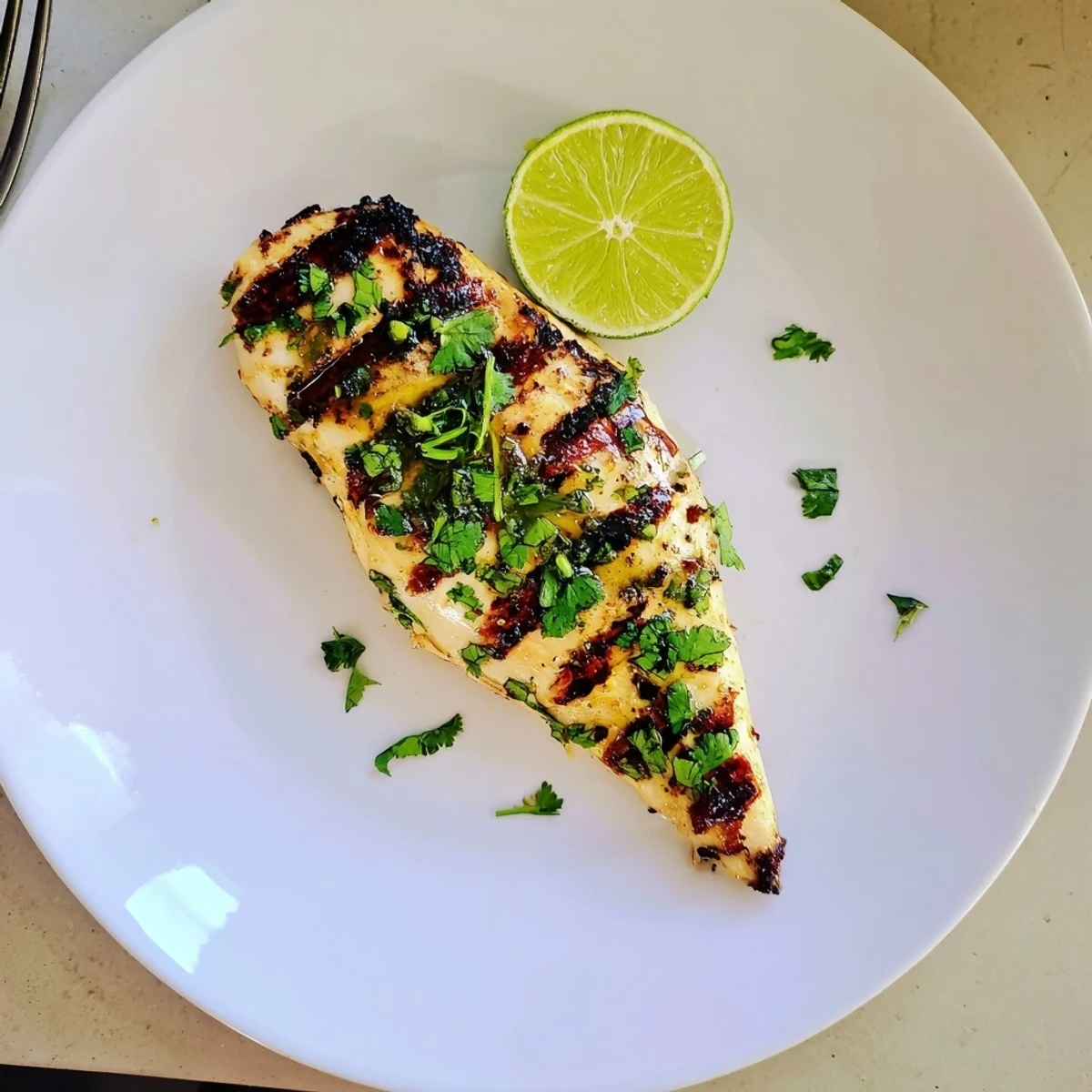 Zesty citrus-marinated Key West grilled chicken showcasing perfect grill marks and juicy, tender meat texture.