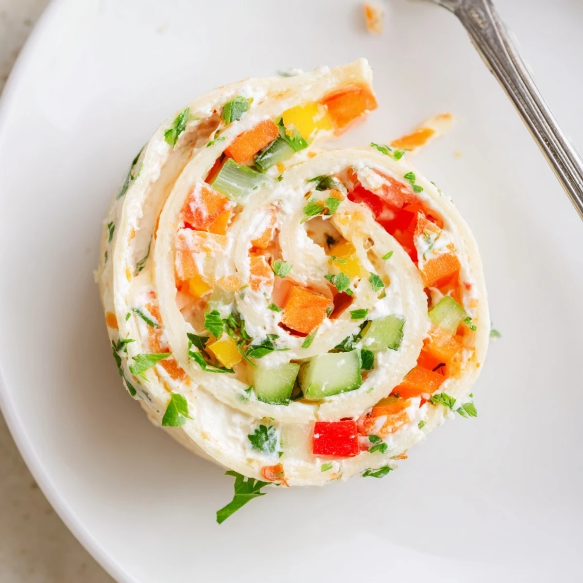 Close-up of Vegetable Tortilla Roll Ups sliced, colorful peppers and cool cucumber