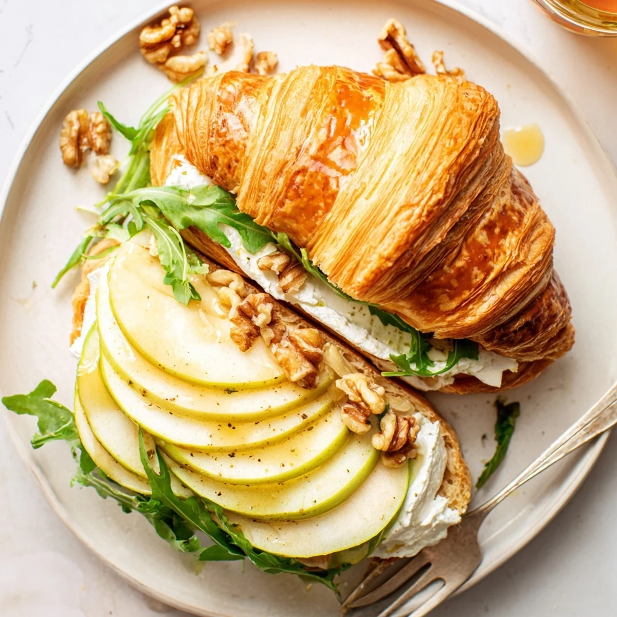 Bright Apple Goat Cheese Croissant Sandwich on a brunch plate, tangy and flaky