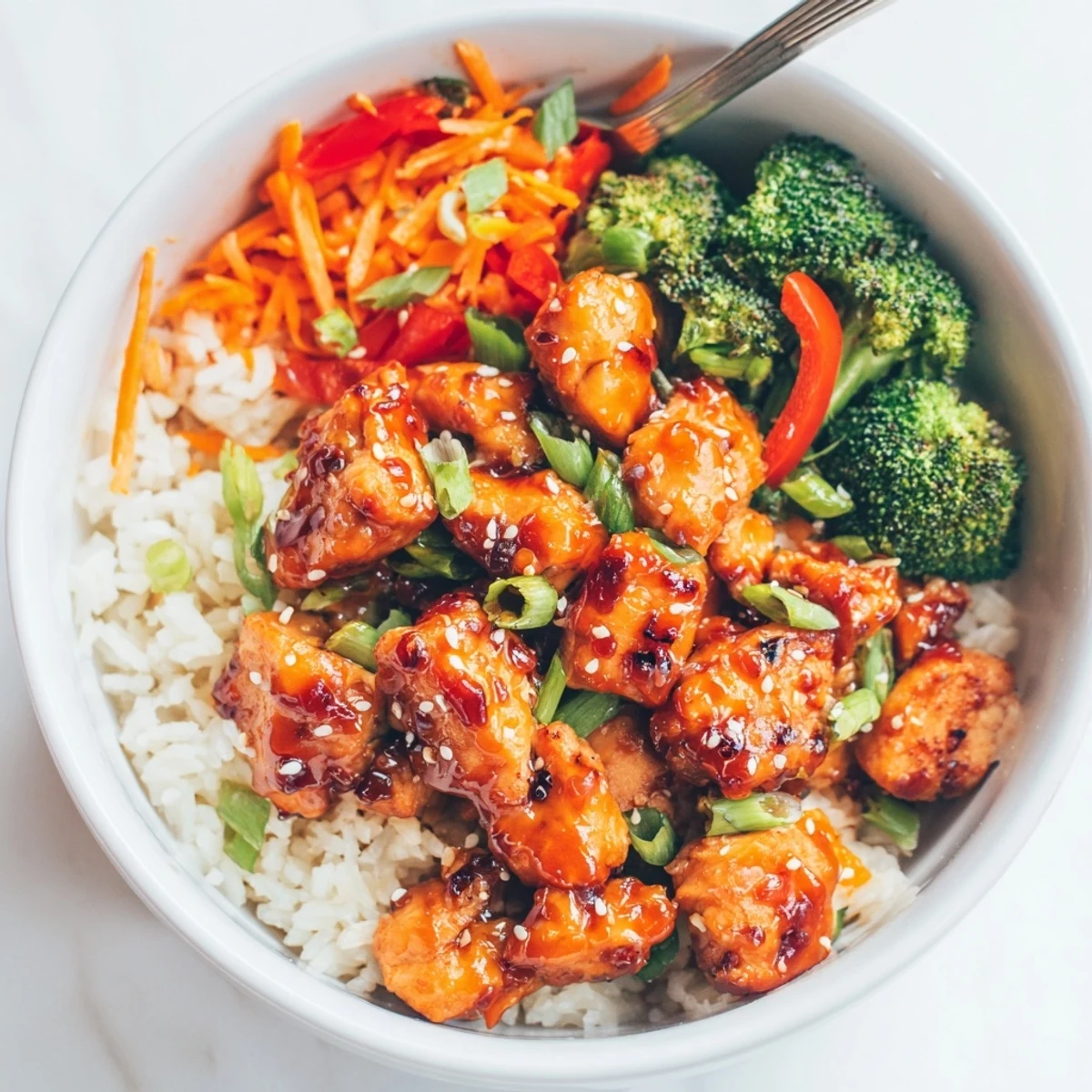 Delicious Orange Glazed Chicken Rice Bowl Recipe To Try with glossy, tangy sauce