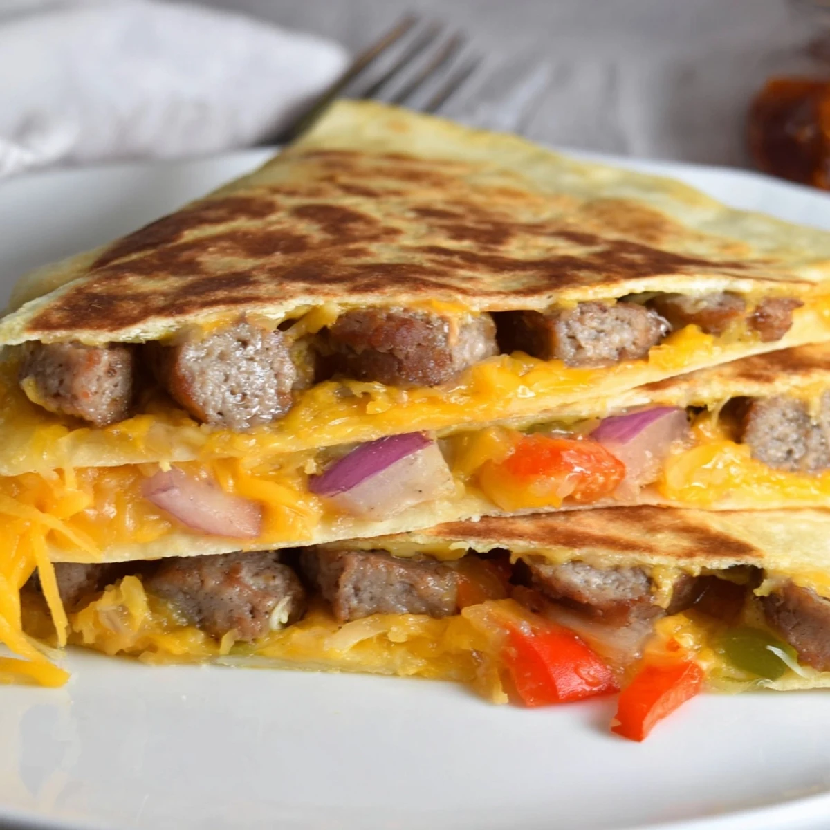 Cajun Beef Sausage Quesadillas With Melty Cheese, golden tortillas oozing warm, seasoned filling