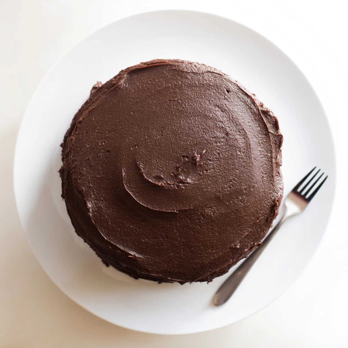 Two-layer Matildas Chocolate Cake with rich cocoa frosting spread smoothly for dessert occasions