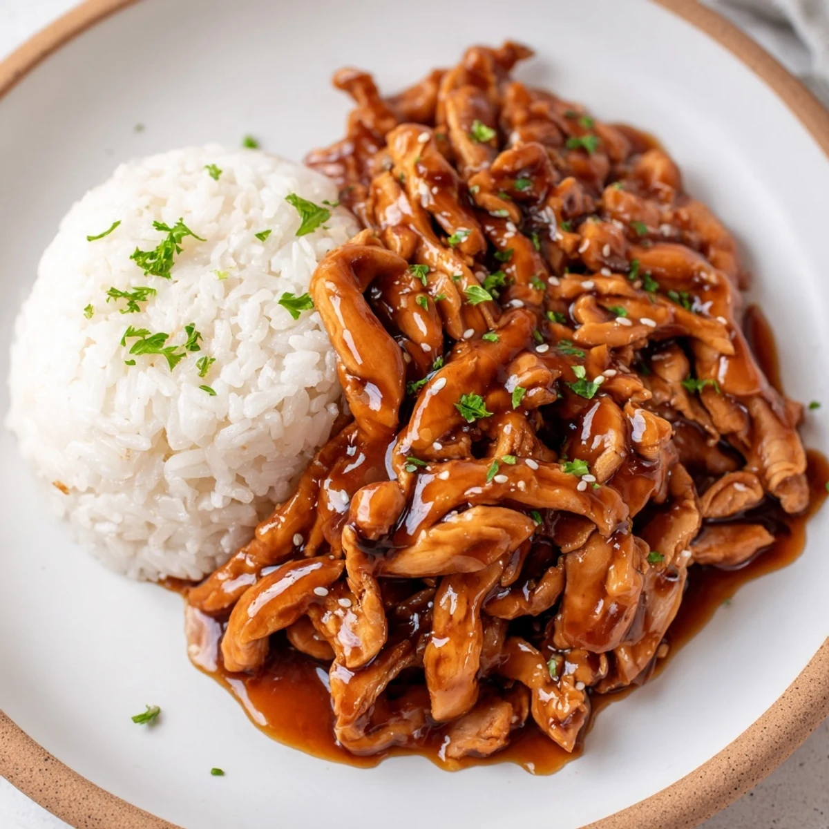 Slow-simmered Crockpot Honey Garlic Chicken with tender pull-apart texture and savory aroma.